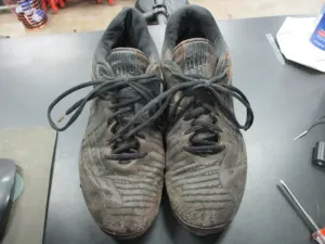 Used New Balance Metal Cleats Size 8.5 - has wear